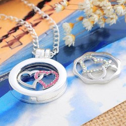 1 médaillon cage, vitré + 2 pièces interchangeables motifs cœurs doubles entrelacés :
2 modèles différents / strass roses + str