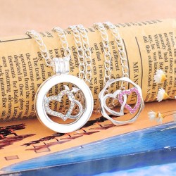 1 médaillon cage, vitré + 2 pièces interchangeables motifs cœurs doubles entrelacés :2 modèles différents / strass roses + str