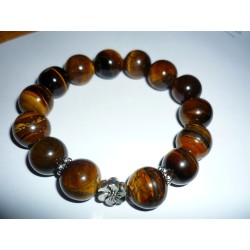 Bracelet aux 14 perles d'oeil du Tigre aux 14mm.- 14 perles.-14mm. - 2 petites couronnes métal.- 1 fleur métal. Bracelet stretch
